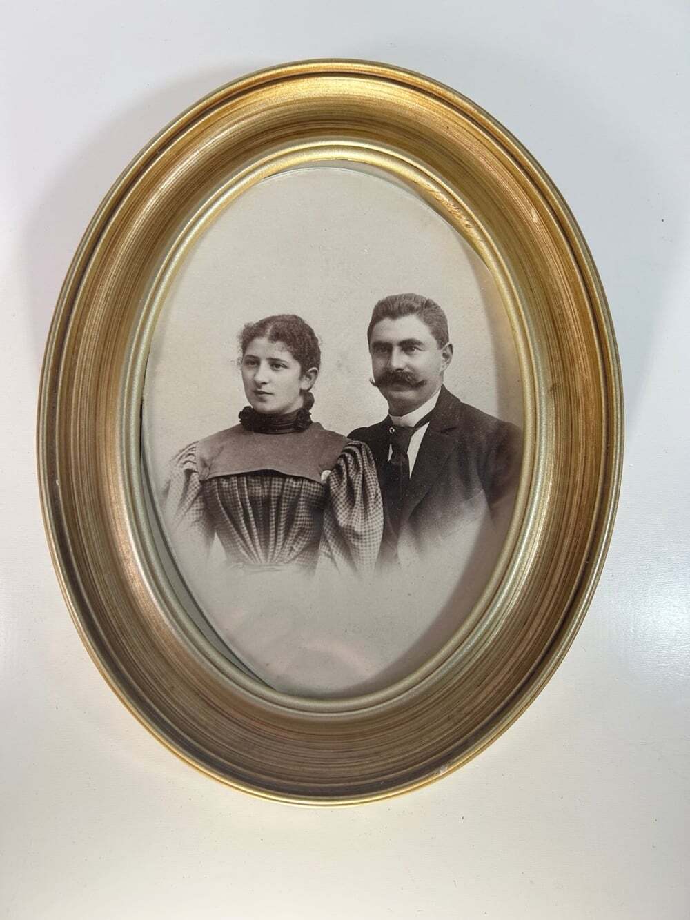 Antique black and white photo of a handsome couple from the Victorian era.